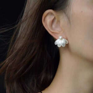 Satin Half-Petal Pearl Earrings on model